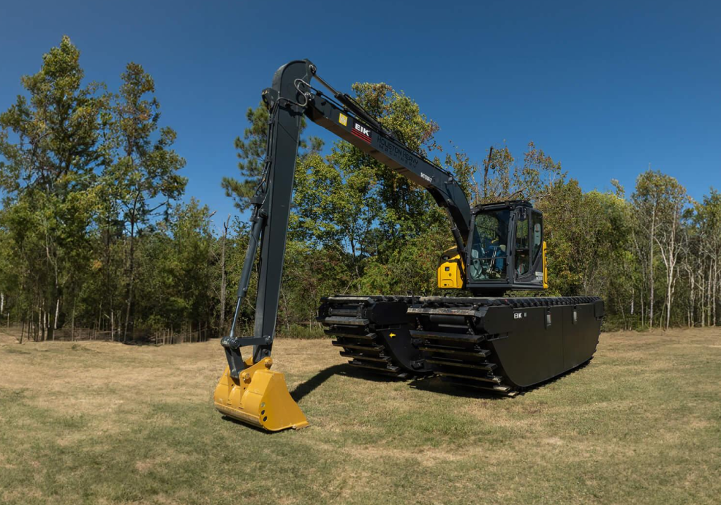 Amphibious excavators feature pontoon-style undercarriages that let them float and maneuver easily through swamps, rivers, and wetlands. They deliver unmatched versatility for dredging, dewatering, and shoreline protection in environments where stability and reach are critical. Photo Credit: EIK Solutions