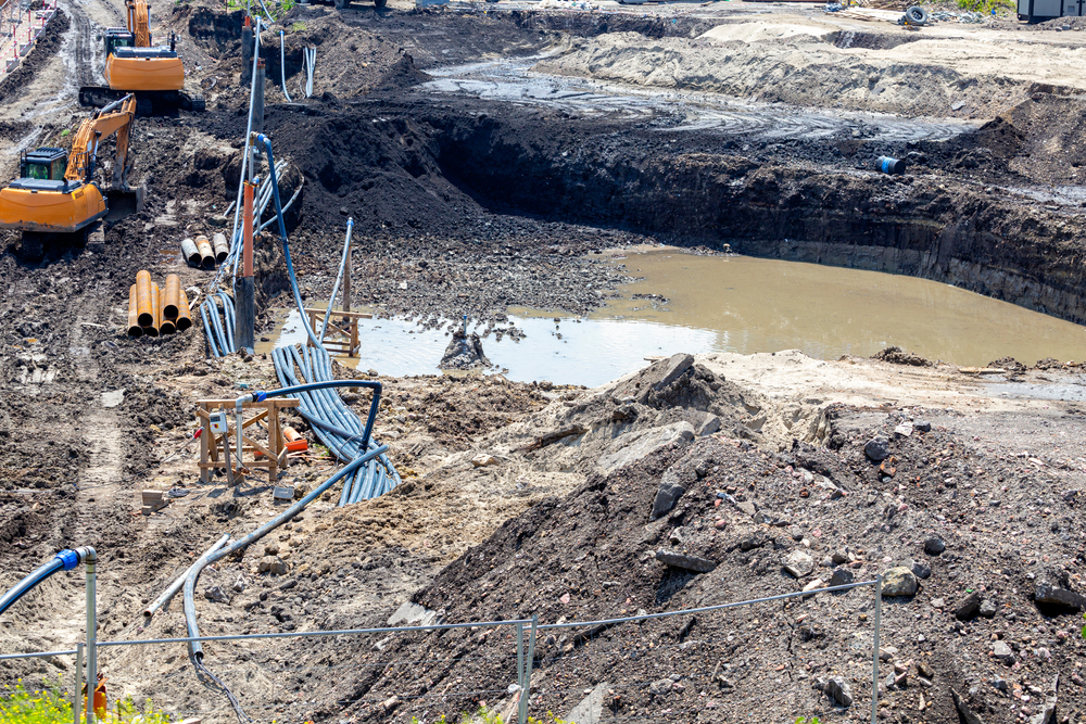 Groundwater in an excavation pit can cause instability and slow construction progress if not properly managed. Heavy equipment is often used alongside dewatering systems to control water levels, maintain dry conditions, and ensure safe excavation in muddy or saturated soil.