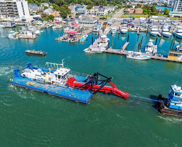 River and channel dredging restores safe operating depths for construction vessels that support piling projects. Without routine dredging, sediment buildup can halt equipment access and delay critical foundation work. Photo Credit: Ellicott Dredges, LLC
