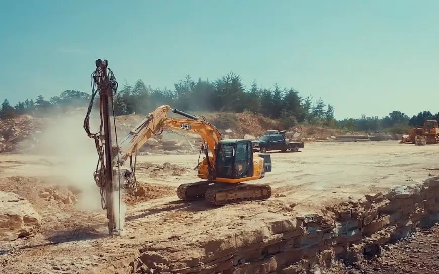 Excavator mounted drilling attachments offer greater reach and positioning control on uneven or restricted access sites. Their versatility allows contractors to use existing fleet equipment without costly replacements. Photo Credit: WORD Rock Drills