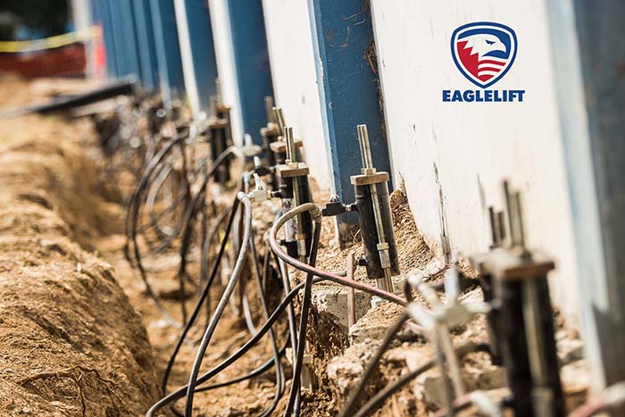 Underpinning systems using helical piles are often selected in areas with soft clay, fill, or moisture driven soil movement that can compromise structural stability. Their adaptability in limited access locations makes them suitable for interior upgrades and tight job sites. Photo Credit: EagleLIFT, Inc.