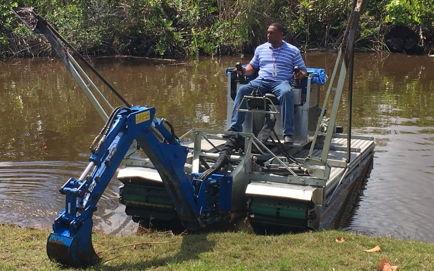 Amphibious construction machines are designed with low ground pressure systems that allow them to operate on saturated soils without sinking. This makes them suitable for waterfront piling projects where conventional equipment cannot maintain stability. Photo Credit: Mobitrac-USA