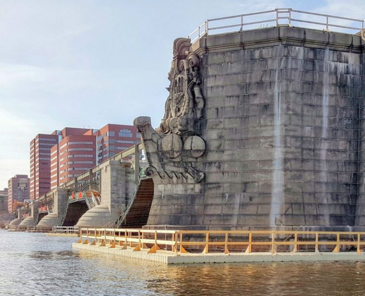 Floating work platforms provide a stable working surface over water, reducing movement and improving crew safety during marine pile driving operations. Their buoyant design allows them to adjust naturally to changing water levels. Photo Credit: FWM Inc.