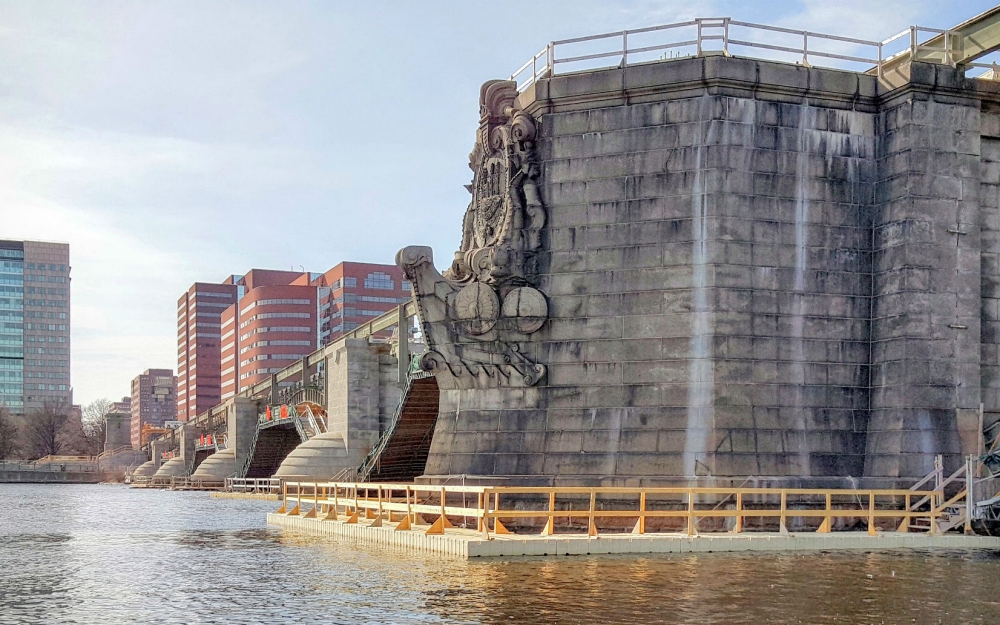Floating work platforms provide a stable working surface over water, reducing movement and improving crew safety during marine pile driving operations. Their buoyant design allows them to adjust naturally to changing water levels. Photo Credit: FWM Inc.