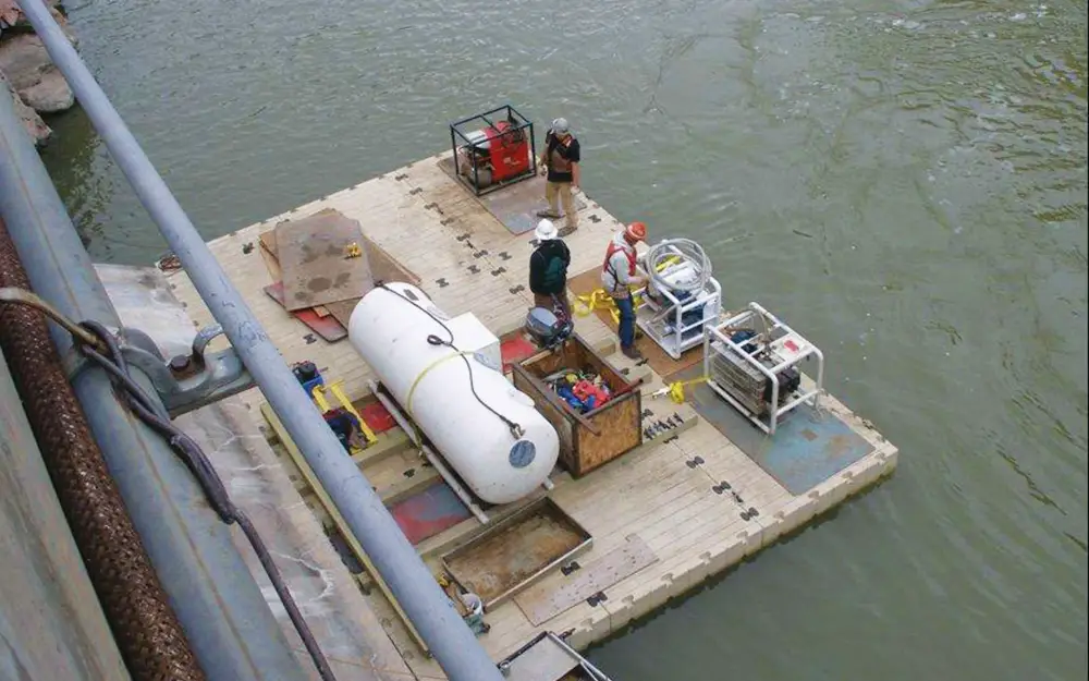 These platforms support heavy pile driving equipment by distributing loads evenly across modular pontoons. This helps maintain alignment accuracy and reduces delays caused by repositioning machinery. Photo Credit: FWM Inc.