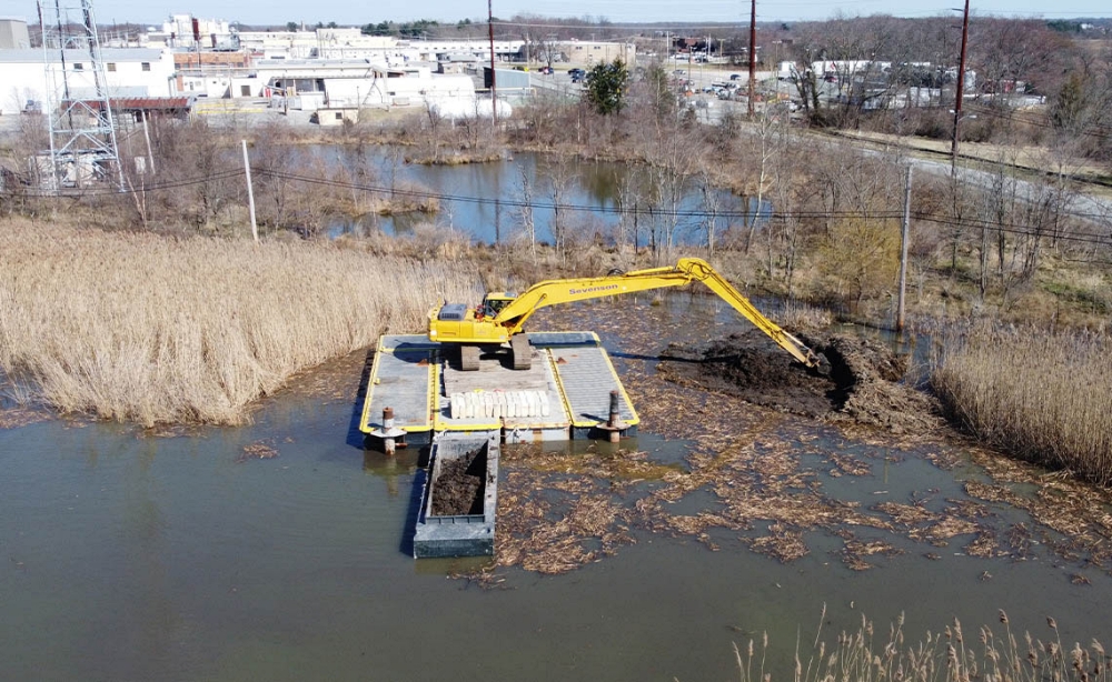 Mechanical dredging removes sediment using buckets or clamshells, allowing precise excavation in confined or contaminated areas. This method is commonly selected for harbor berths, docks, and environmental remediation sites. Photo Credit: Sevenson Environmental Services