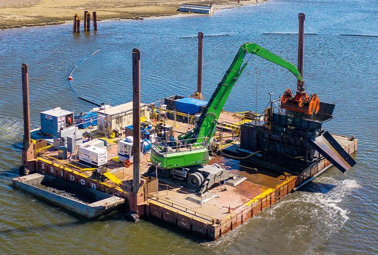 Hydraulic dredging moves sediment as a slurry through pipelines, making it effective for large volumes of fine-grained material in open waterways. It is widely used for navigation channel maintenance and beach nourishment projects. Photo Credit: Sevenson Environmental Services