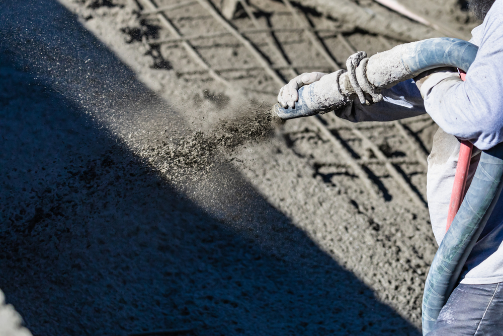 Shotcrete is widely used in seawall and bulkhead reinforcement because its high velocity application improves bonding to vertical and irregular marine surfaces. This dense placement helps reduce permeability and slows chloride intrusion in coastal environments.