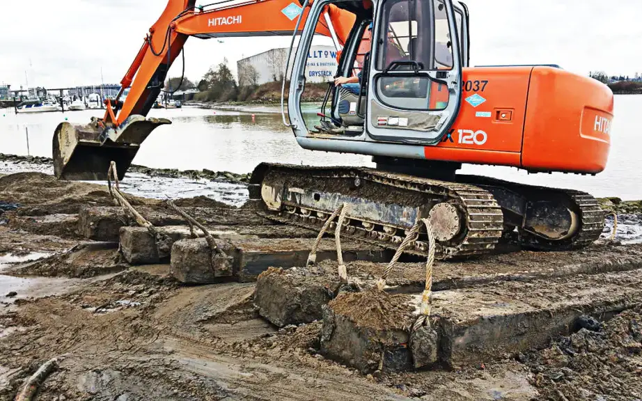 Properly specified construction timber helps distribute heavy equipment loads, reducing ground pressure and improving stability on temporary access routes. This function is especially critical on soft soils and marine construction sites. Photo Credit: CarlWood Lumber Limited