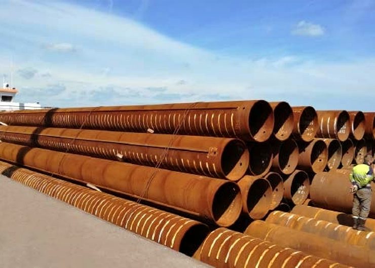 Large-diameter steel pipe piles are commonly used in marine and heavy civil construction because they can transfer high axial and lateral loads to deeper, more stable soil layers. Their circular shape provides efficient structural performance in both soft and variable ground conditions. Photo Credit: NOKSEL ESPAÑA