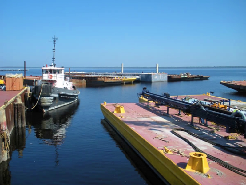 Marine construction projects often rely on barges as floating work platforms for cranes, pile driving equipment, and material staging. Tugboats enable precise positioning and safe movement of these barges in confined waterways and active construction zones. Photo Credit: MOBRO Marine, Inc.