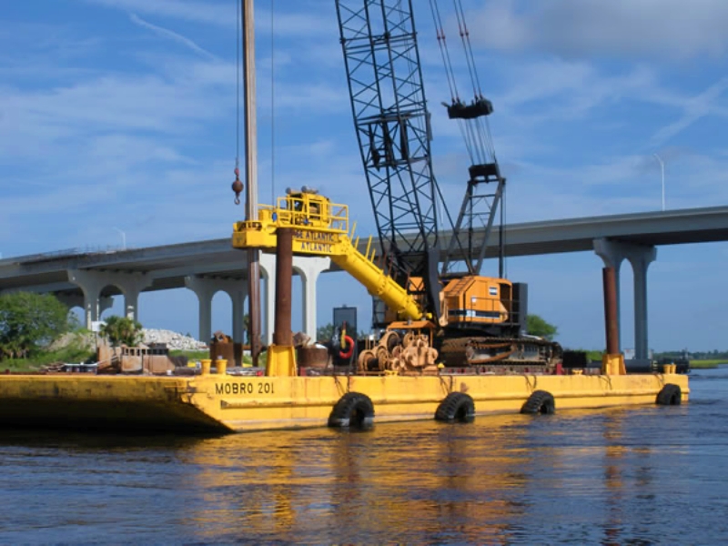 Experienced barge and tugboat service providers maintain compliance with maritime regulations and follow structured maintenance and safety programs. These practices help reduce downtime and support consistent performance throughout long duration construction projects. Photo Credit: MOBRO Marine, Inc.