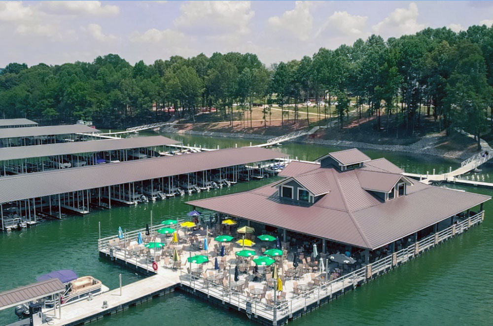 Dock material selection plays a major role in long term maintenance costs for marine facilities. Timber, steel, aluminum, and composite systems each respond differently to moisture, biological activity, and mechanical wear. Photo Credit: Meeco Sullivan