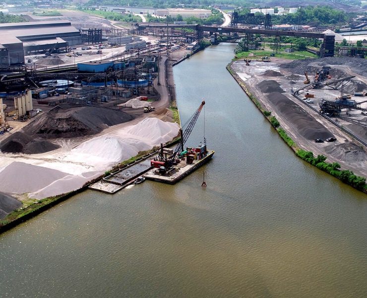 Mechanical and hydraulic dredging can increase turbidity by resuspending fine sediments into the water column. Proper monitoring and containment measures significantly reduce how far these suspended particles travel. Photo Credit: Ryba Marine Construction Co.