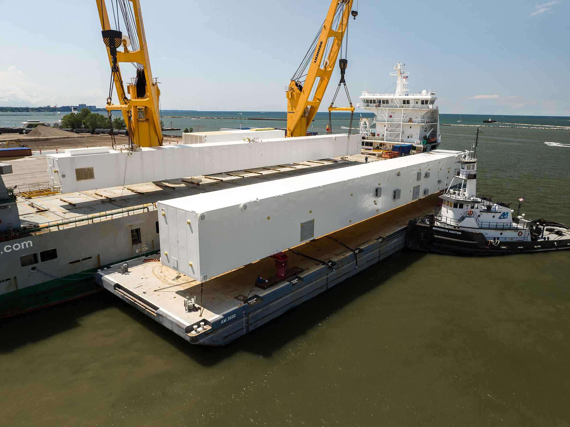 Barge and tug transport reduces material handling by allowing direct delivery to waterfront and nearshore construction sites. This improves scheduling efficiency and minimizes onshore staging requirements. Photo Credit: Ashton Marine