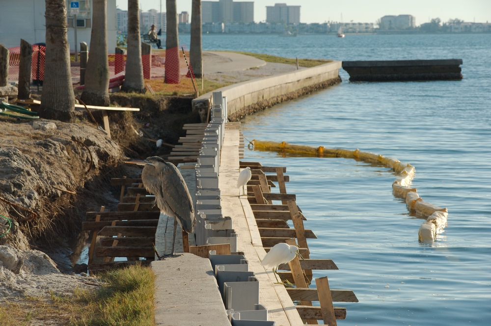Saltwater intrusion accelerates corrosion in reinforced concrete and steel seawalls by introducing chlorides into structural elements. Effective waterproofing systems slow this process and extend service life in coastal environments.
