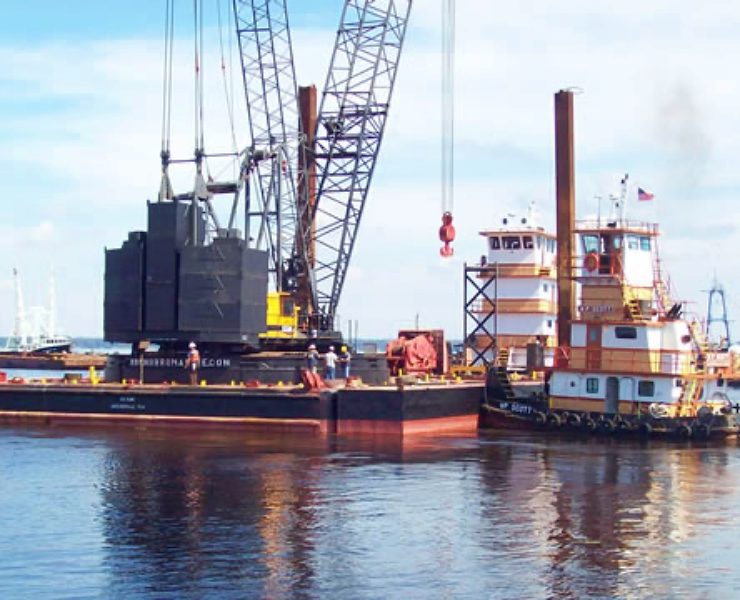 Barges and tugboats serve as essential support assets in marine construction by transporting equipment, stabilizing work platforms, and enabling precise positioning on water. Their reliability directly affects construction schedules, safety performance, and project costs. Photo Credit: MOBRO Marine, Inc.