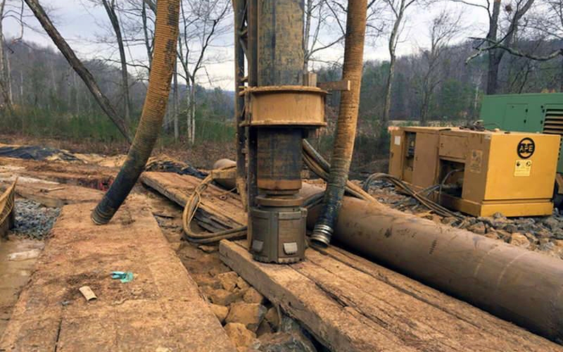 Casing friction frequently spikes at transition zones due to inconsistent borehole diameter and partial rock contact. Excessive friction can lead to refusal or casing damage if not managed properly. Photo Credit: Center Rock, Inc.