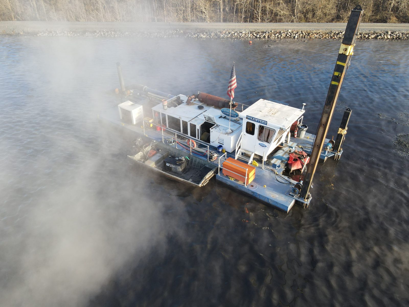 Hydraulic dredging systems transport sediment through pipelines extending thousands of feet from the dredge location without requiring hopper barges. These portable systems excel in confined spaces like inland waterways and industrial basins where traditional large-scale equipment cannot access. Photo Credit: Dredge America, Inc.