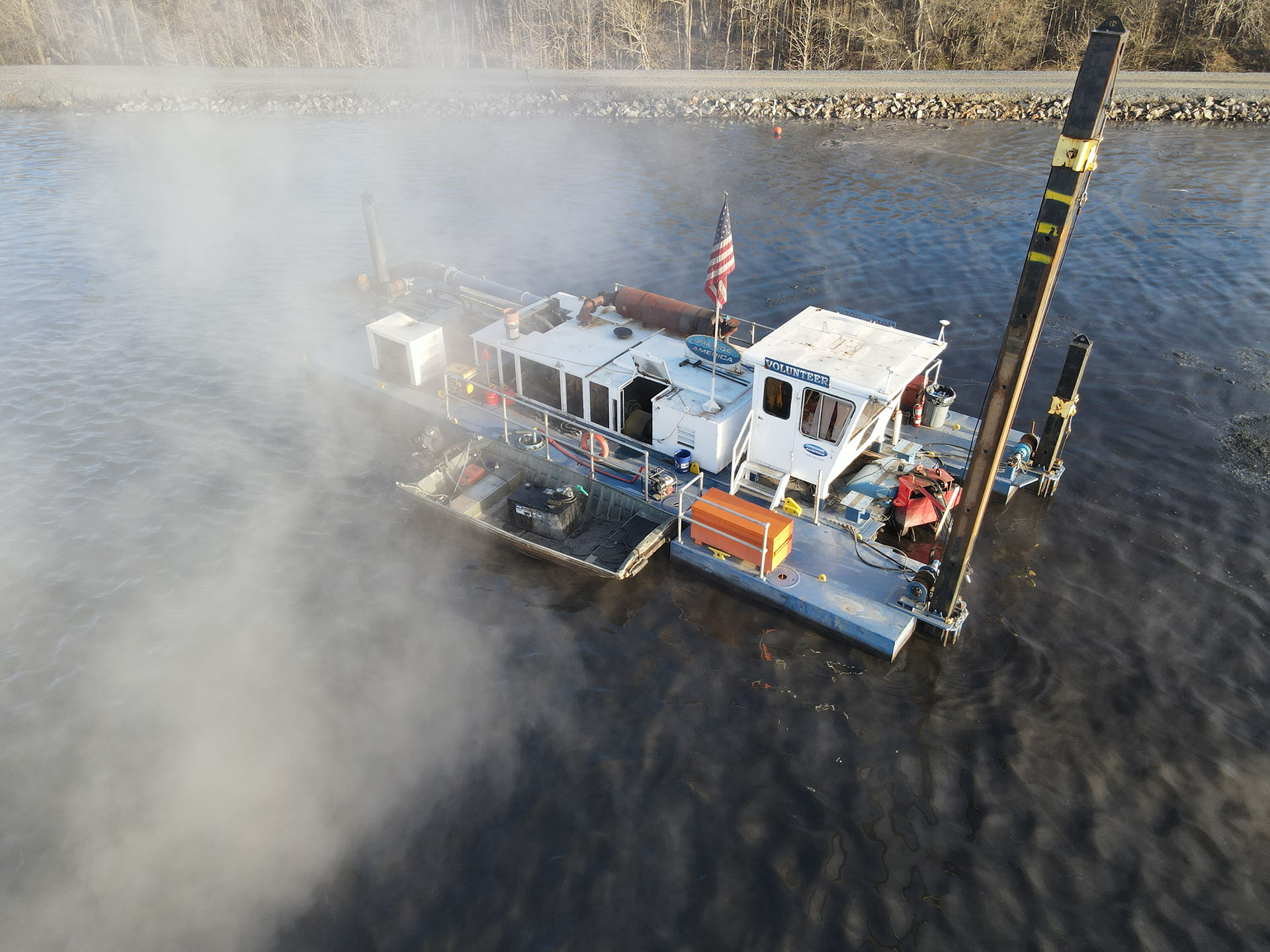 Hydraulic dredging systems transport sediment through pipelines extending thousands of feet from the dredge location without requiring hopper barges. These portable systems excel in confined spaces like inland waterways and industrial basins where traditional large-scale equipment cannot access. Photo Credit: Dredge America, Inc.