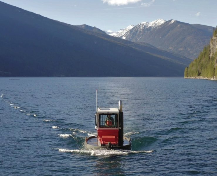 Shallow draft workboats are specifically engineered to operate in limited water depths where conventional vessels cannot navigate. This makes them essential for piling projects in remote rivers and shallow inland lakes. Photo Credit: Drop Marine