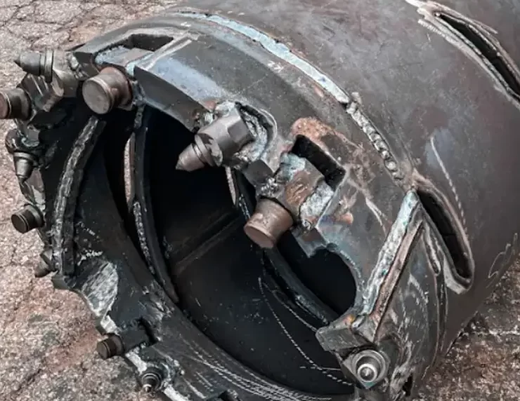 High-strength rock formations can significantly slow drilling progress and increase equipment wear during deep foundation construction. These conditions often require specialized drilling approaches to maintain borehole stability and alignment. Photo Credit: Champion Equipment Co