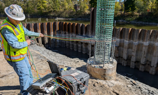 CSL uses ultrasonic signals between water-filled access tubes. It evaluates concrete between the tube pairs. Photo Credit: GRL Engineers, Inc